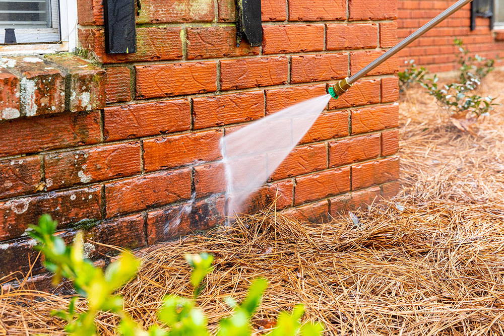 How to Properly Pressure Wash a Brick House Without Damaging It